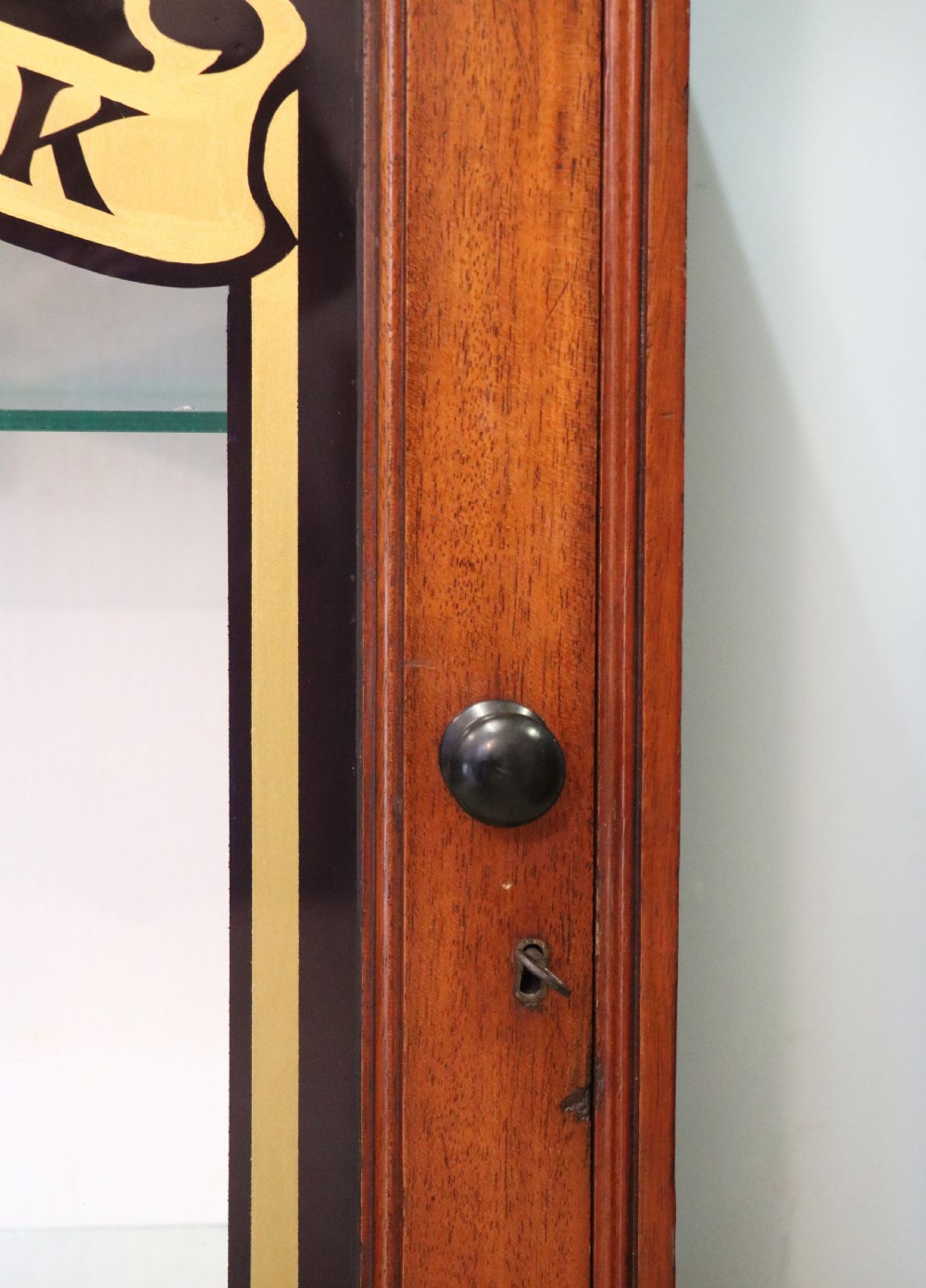 A lovely mahogany framed wall mounted display cabinet hand sign written for Cadburys Chocolate View XIII