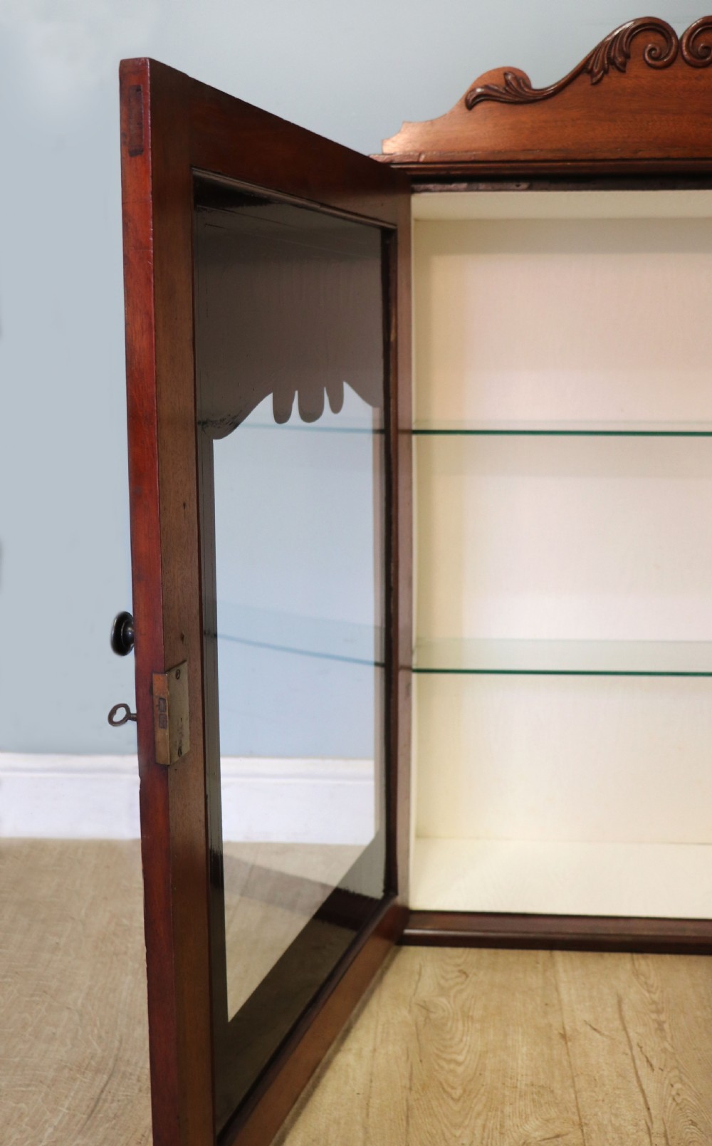 A lovely mahogany framed wall mounted display cabinet hand sign written for Cadburys Chocolate View XVI