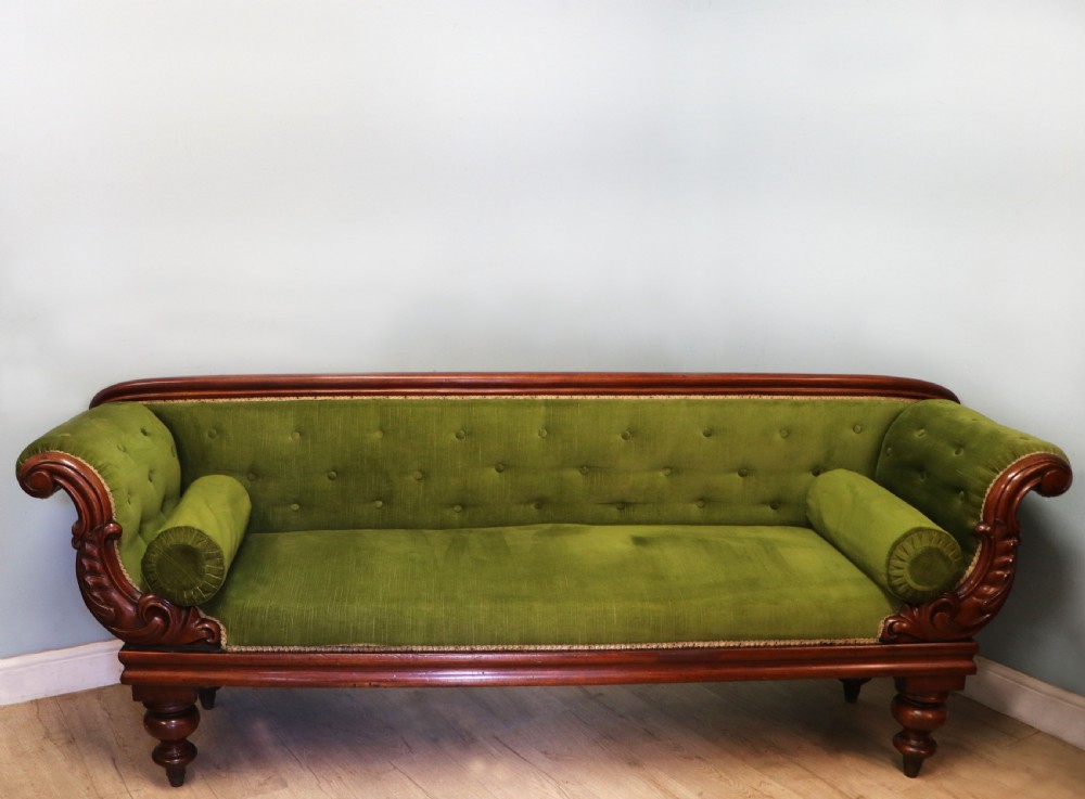 A superb vintage green Victorian sofa.