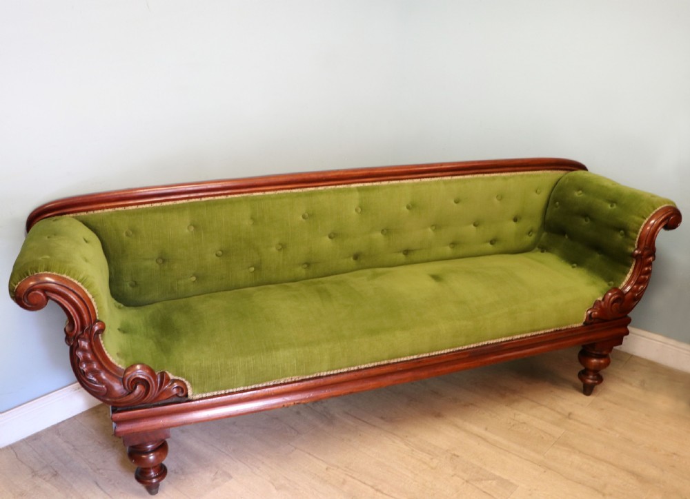 A superb vintage green Victorian sofa. View II