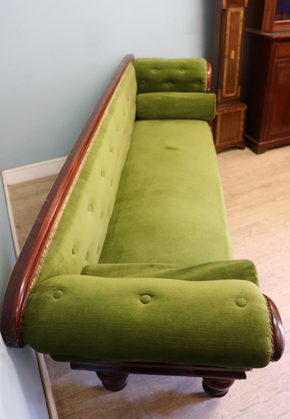 A superb vintage green Victorian sofa. View III