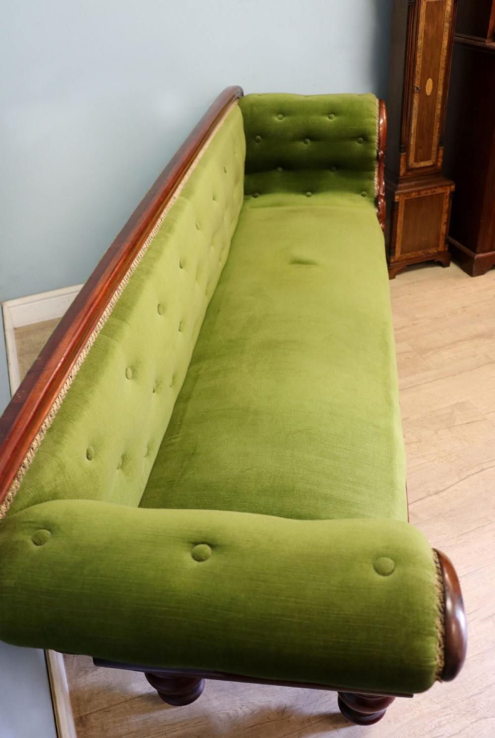 A superb vintage green Victorian sofa. View IV