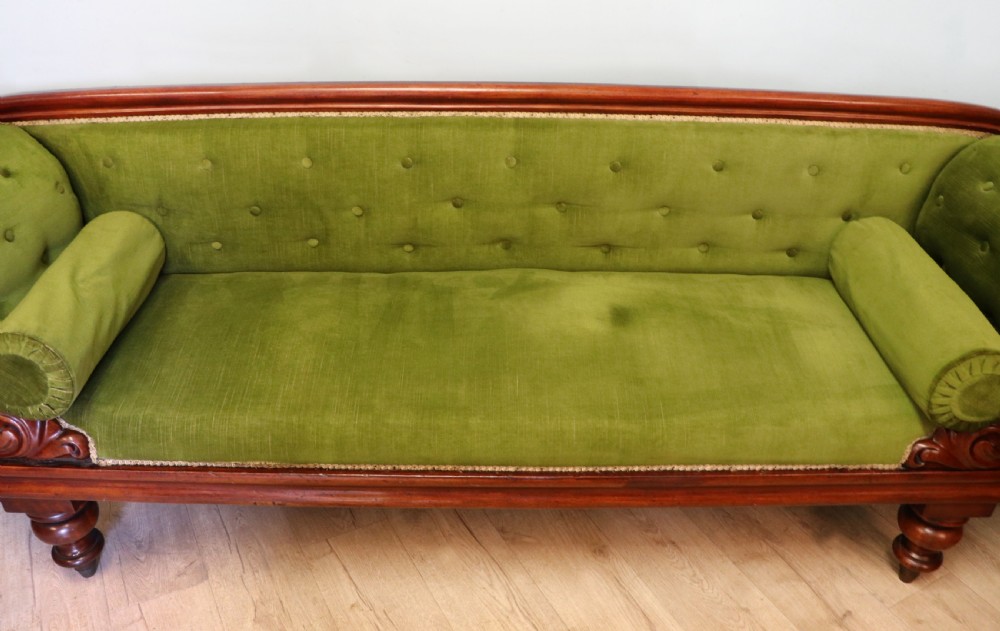 A superb vintage green Victorian sofa. View V