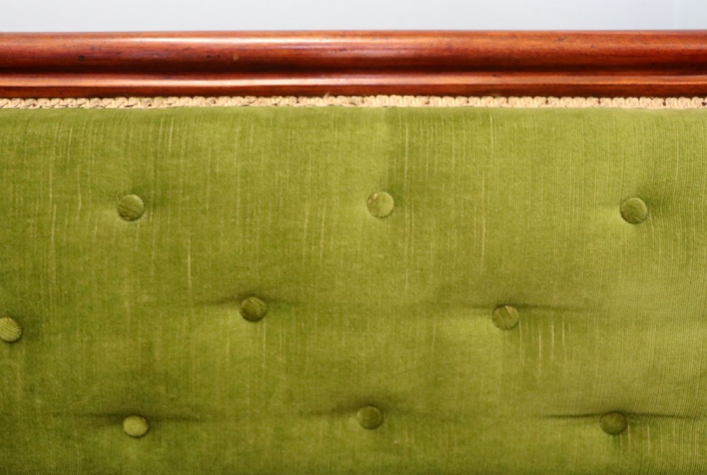 A superb vintage green Victorian sofa. View VI
