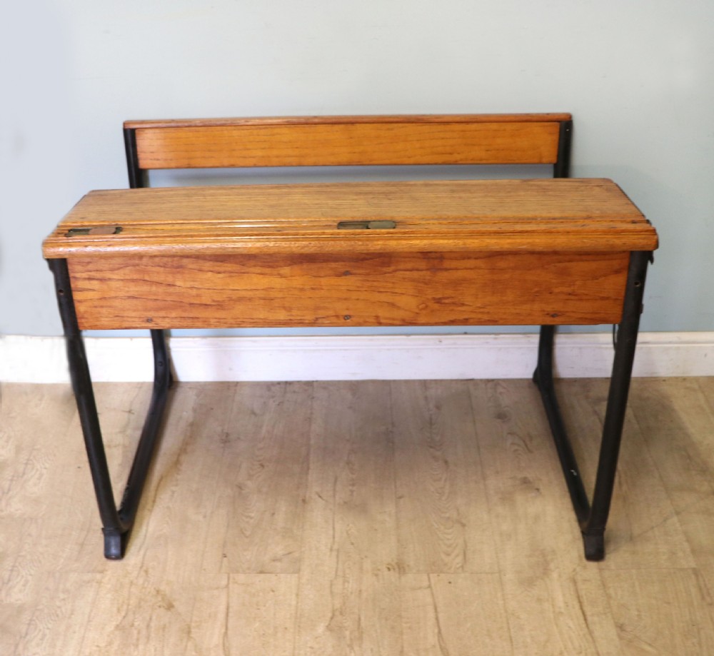 A wonderful early 20th century oak and iron framed school desk and integral chair.  View IV