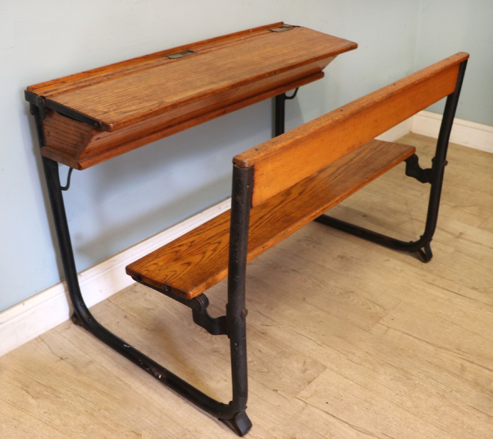A wonderful early 20th century oak and iron framed school desk and integral chair.  View V