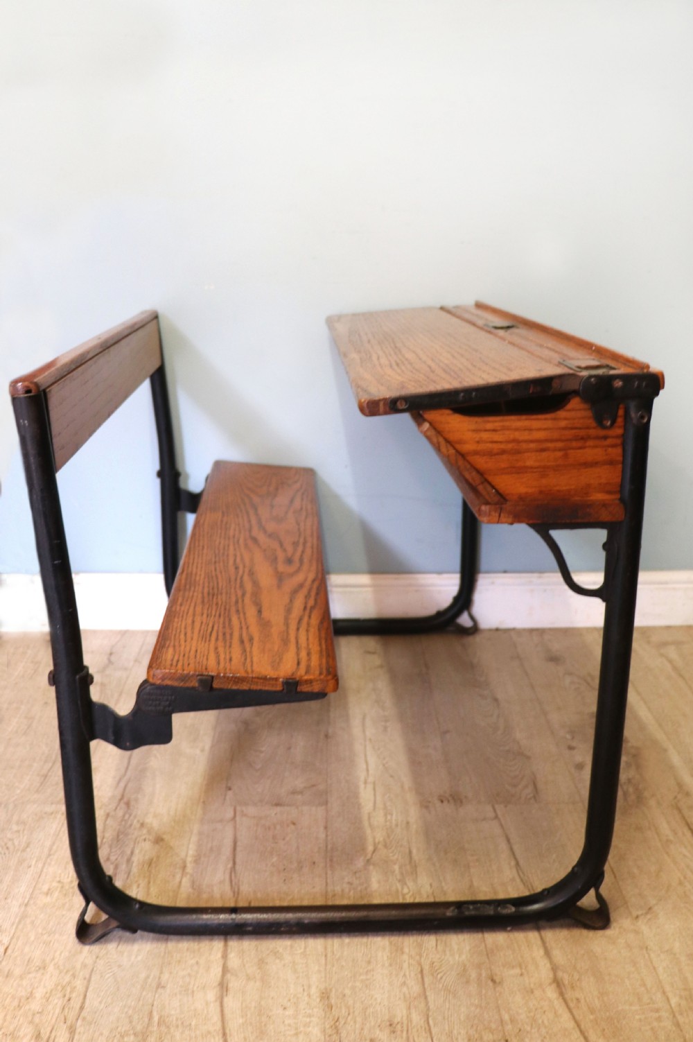 A wonderful early 20th century oak and iron framed school desk and integral chair.  View VI