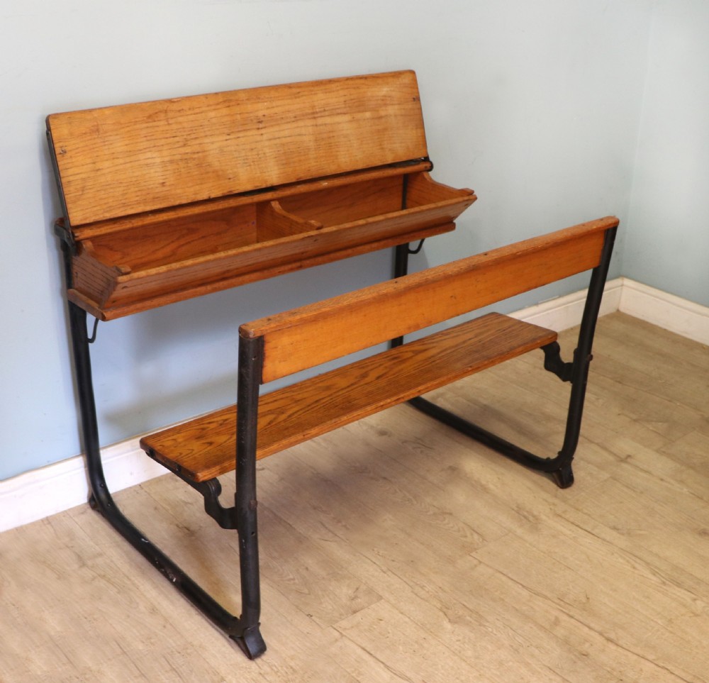 A wonderful early 20th century oak and iron framed school desk and integral chair.  View VIII