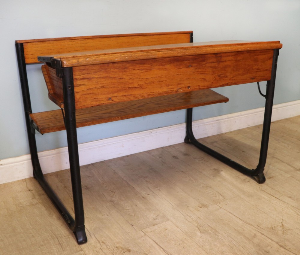 A wonderful early 20th century oak and iron framed school desk and integral chair.  View IX