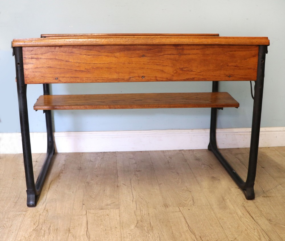 A wonderful early 20th century oak and iron framed school desk and integral chair.  View X