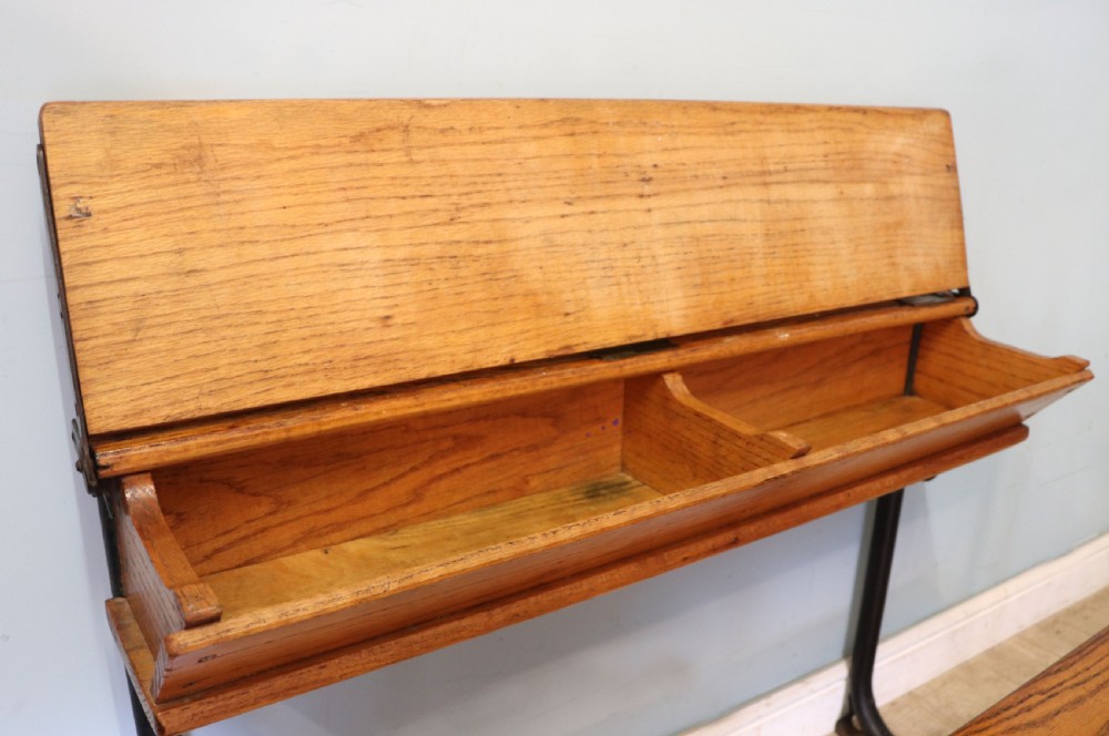 A wonderful early 20th century oak and iron framed school desk and integral chair.  View XII