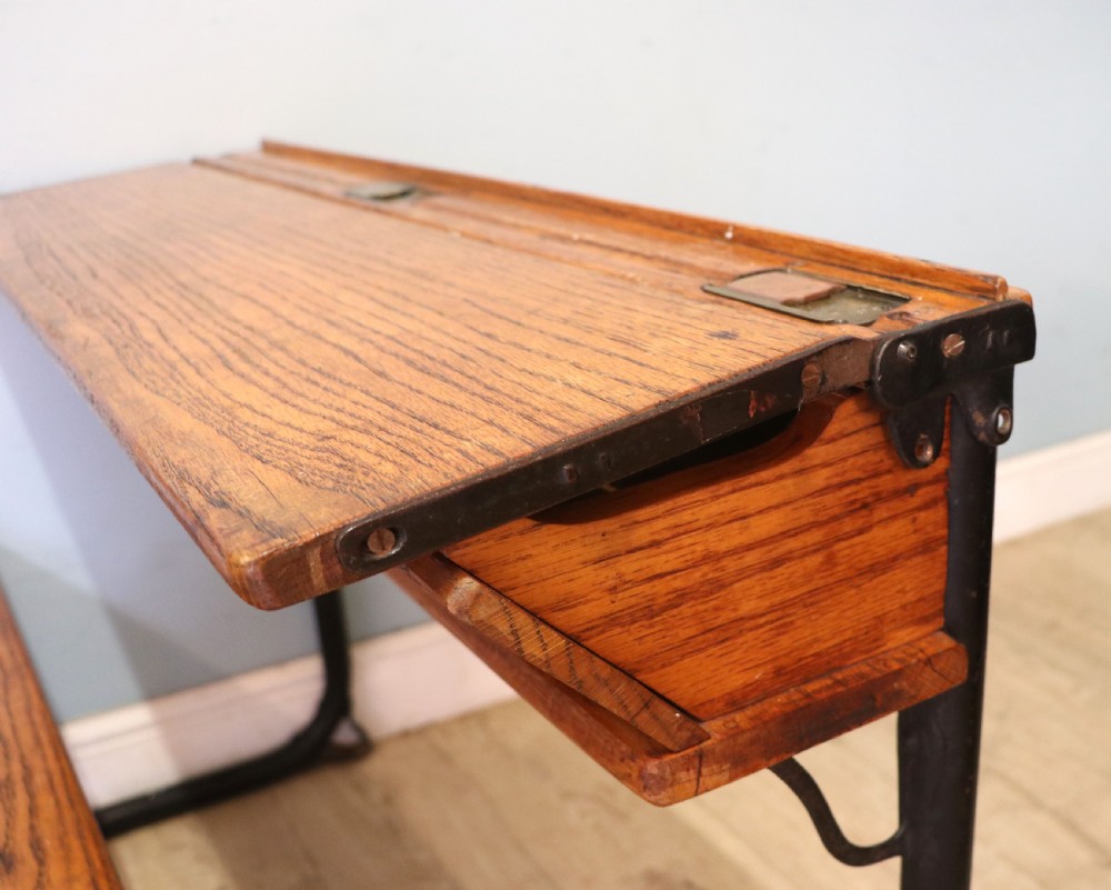 A wonderful early 20th century oak and iron framed school desk and integral chair.  View XIV