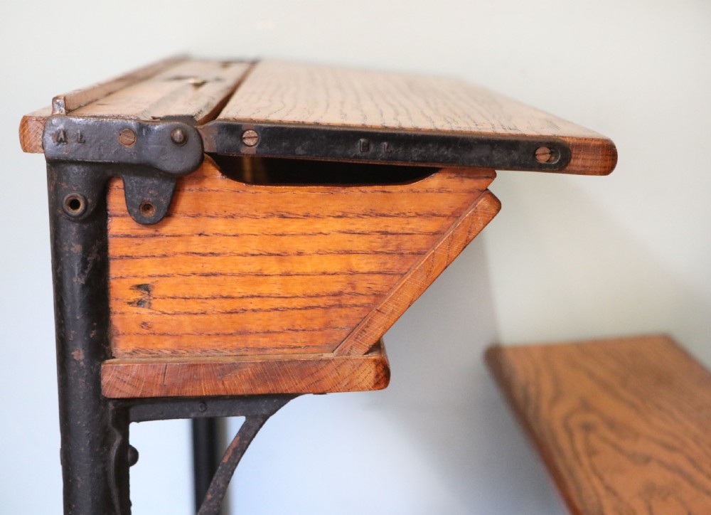 A wonderful early 20th century oak and iron framed school desk and integral chair.  View XV