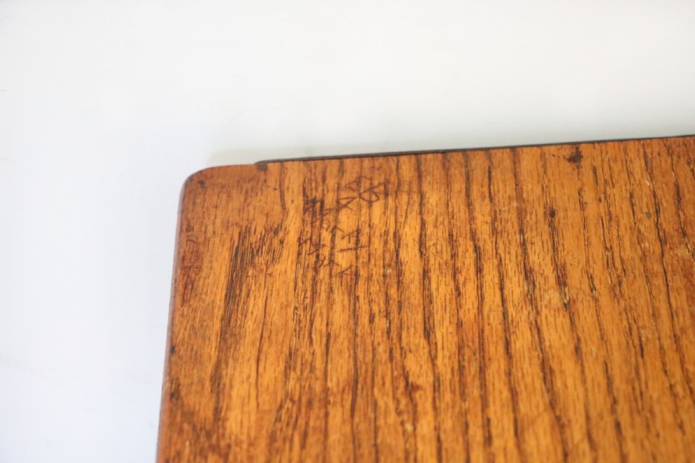 A wonderful early 20th century oak and iron framed school desk and integral chair.  View XVI