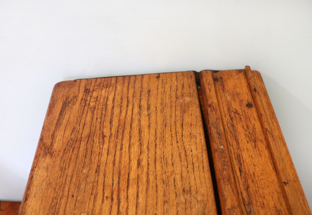 A wonderful early 20th century oak and iron framed school desk and integral chair.  View XVII