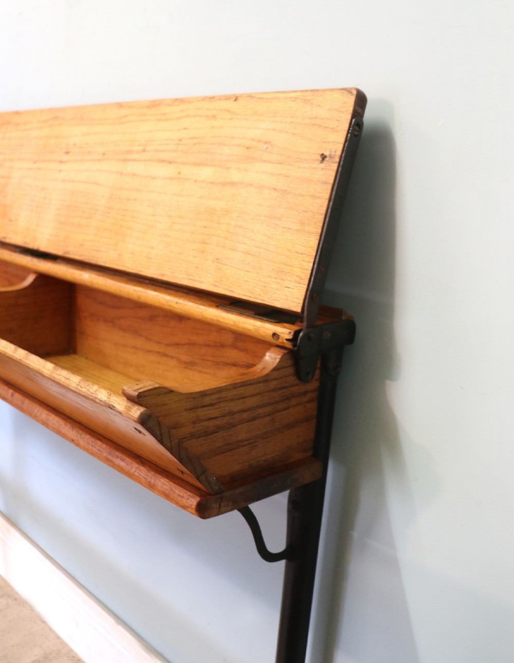 A wonderful early 20th century oak and iron framed school desk and integral chair.  View XIX