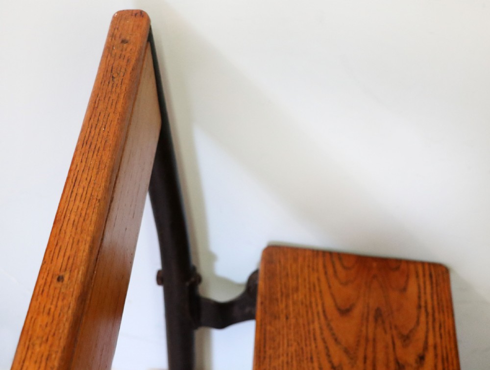 A wonderful early 20th century oak and iron framed school desk and integral chair.  View XXIII
