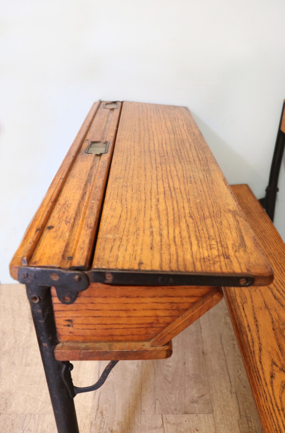 A wonderful early 20th century oak and iron framed school desk and integral chair.  View XXV