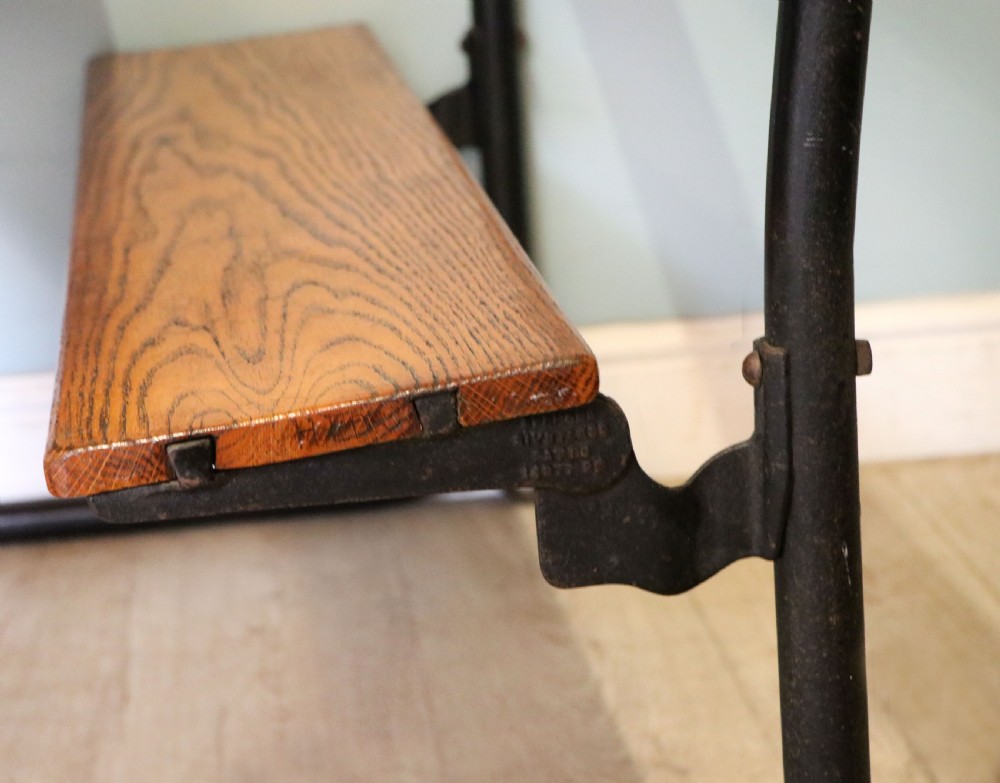 A wonderful early 20th century oak and iron framed school desk and integral chair.  View XXVIII