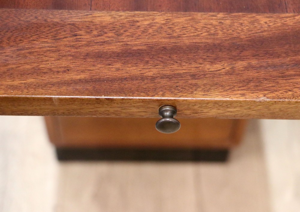 A superb quality stylish 20th century mahogany twin pedestal desk. View XXVII