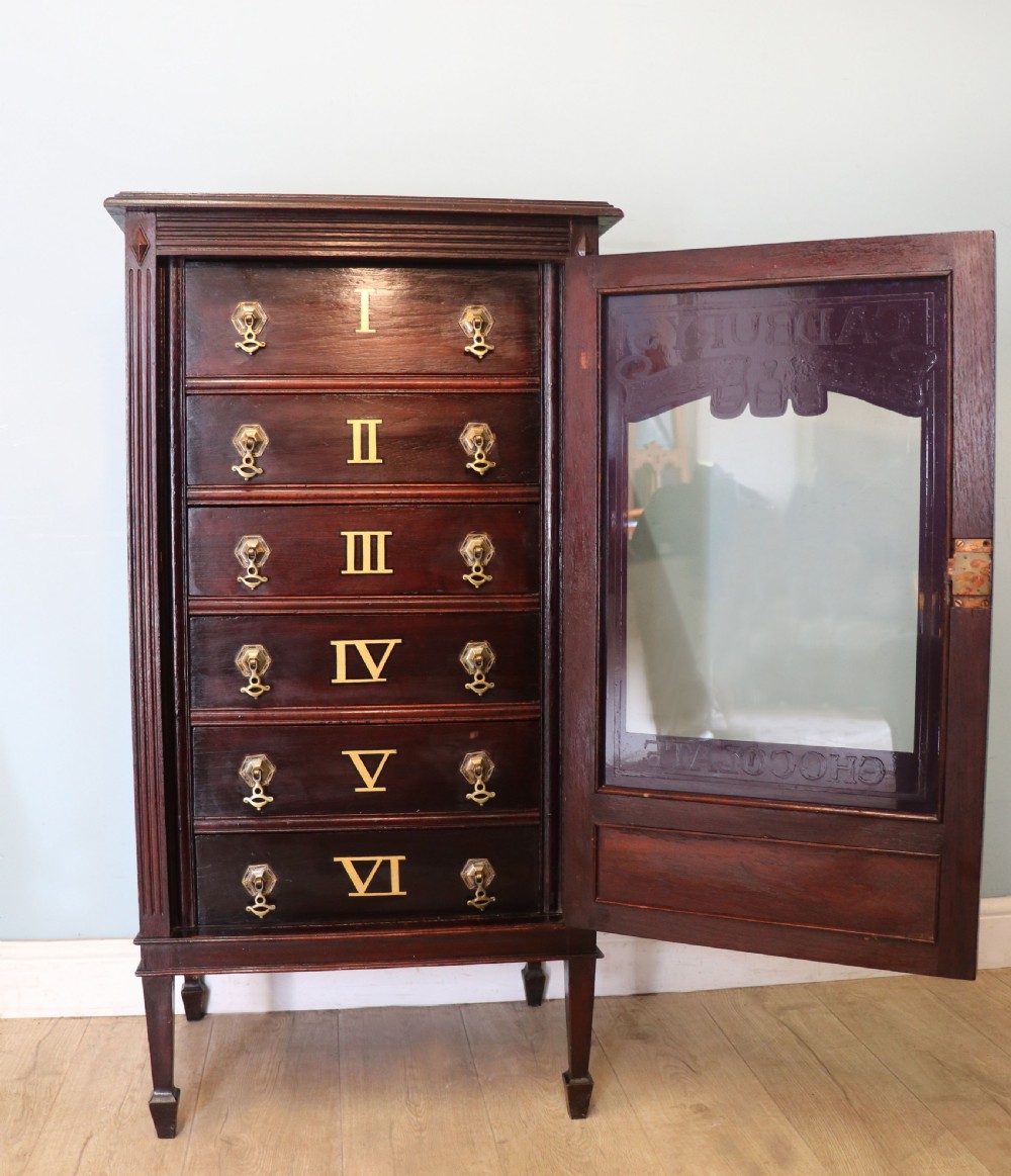 A lovely dark mahogany cabinet hand sign written for Cadburys chocolate. View III