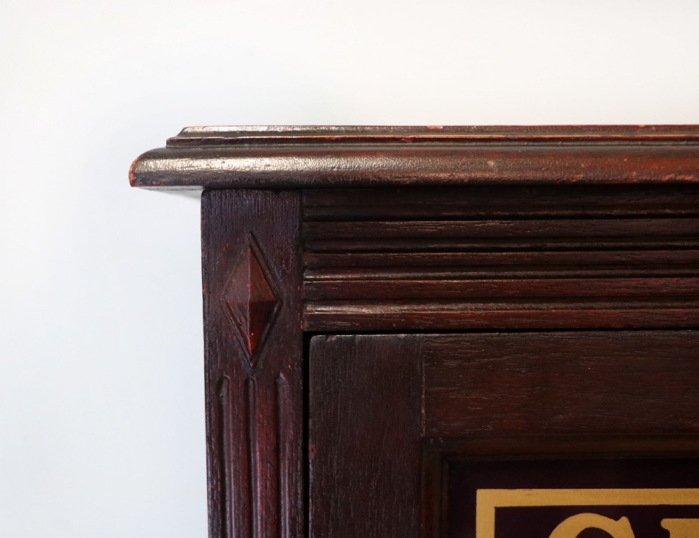 A lovely dark mahogany cabinet hand sign written for Cadburys chocolate. View IX