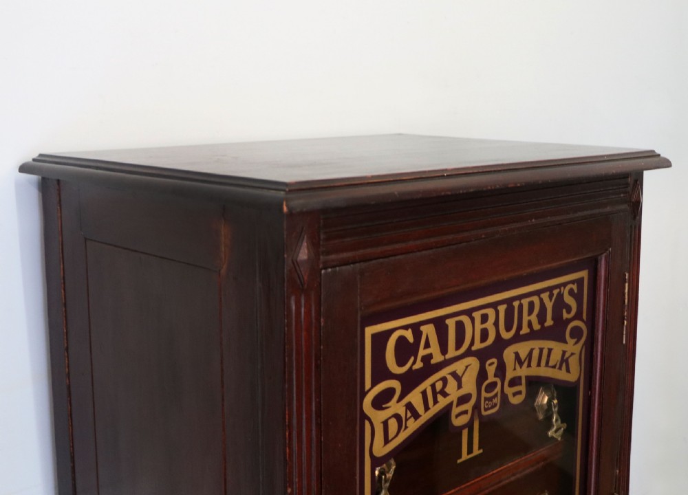 A lovely dark mahogany cabinet hand sign written for Cadburys chocolate. View X