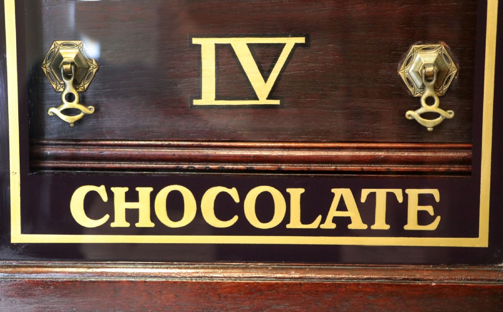 A lovely dark mahogany cabinet hand sign written for Cadburys chocolate. View XVII