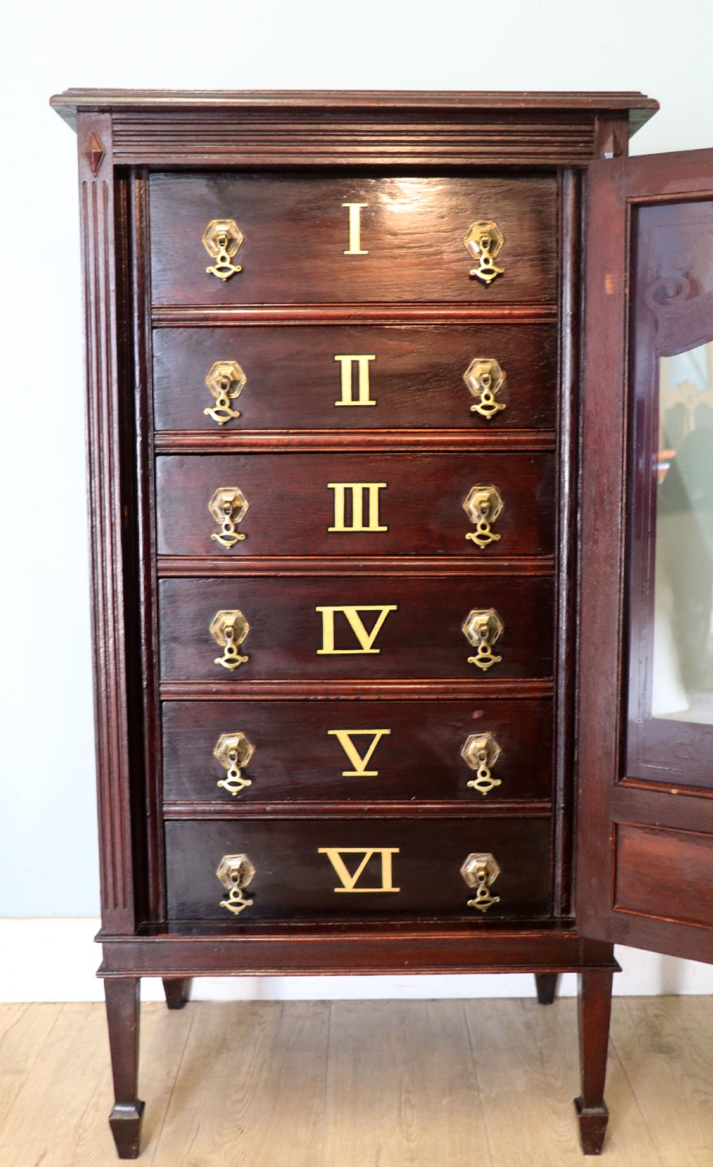 A lovely dark mahogany cabinet hand sign written for Cadburys chocolate. View XVIII