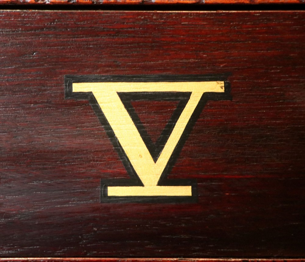 A lovely dark mahogany cabinet hand sign written for Cadburys chocolate. View XXIV