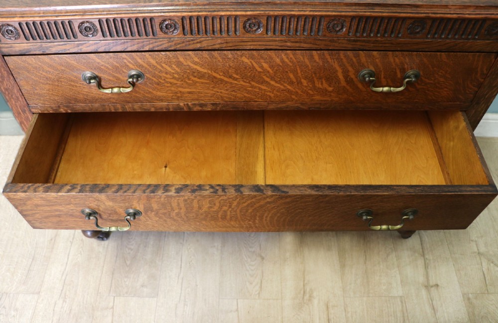 A Edwardian oak combination chest and cupboard. View VII