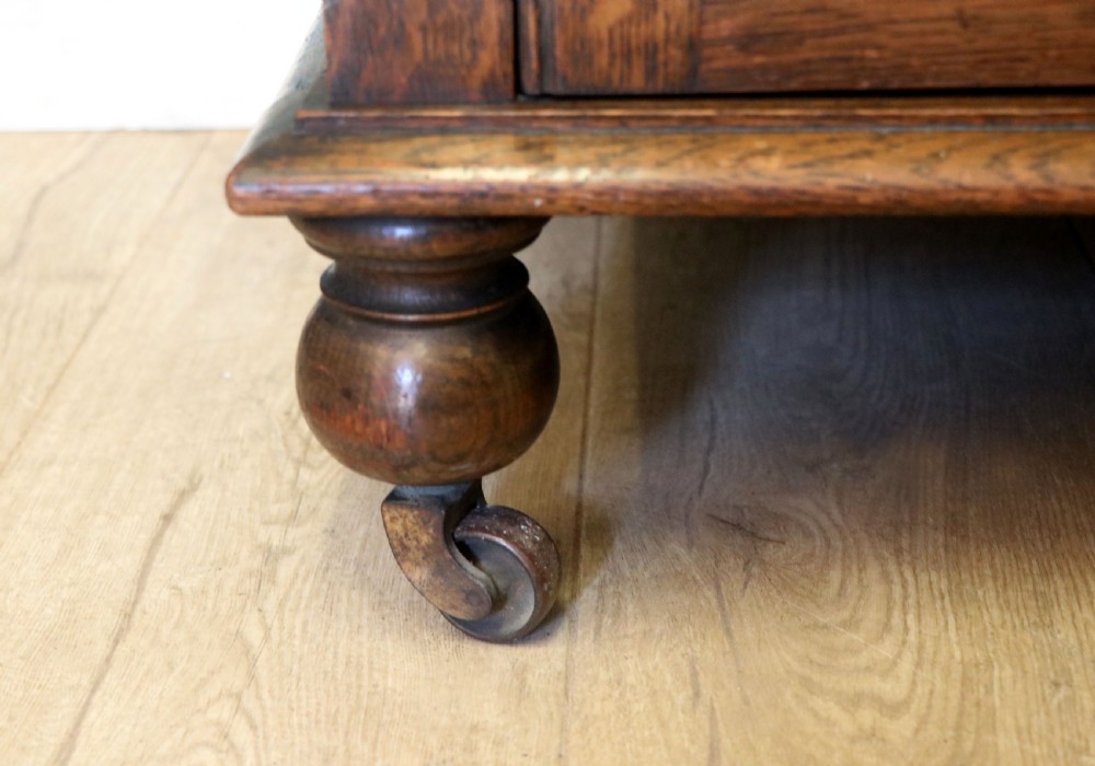 A Edwardian oak combination chest and cupboard. View VIII
