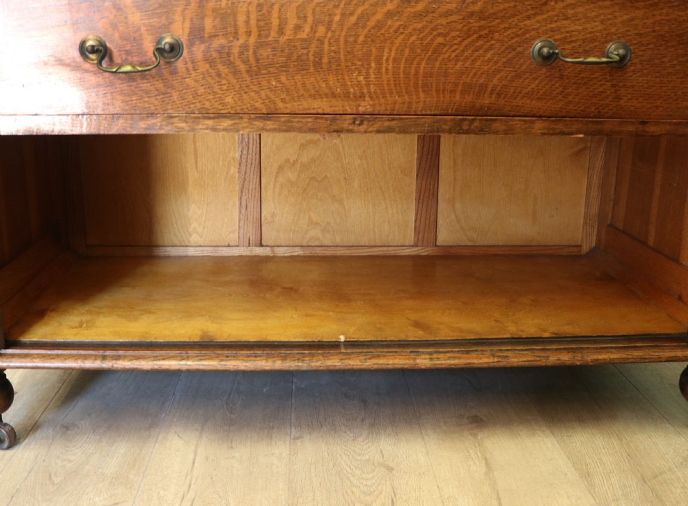 A Edwardian oak combination chest and cupboard. View XII