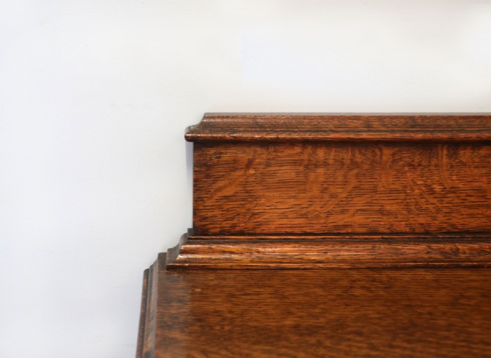 A Edwardian oak combination chest and cupboard. View XV