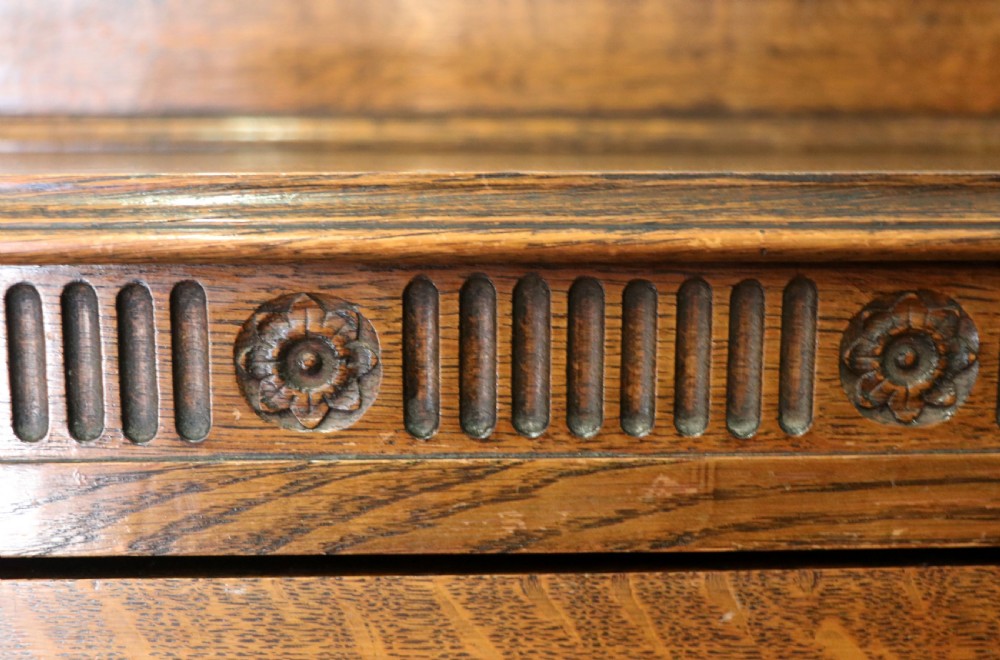 A Edwardian oak combination chest and cupboard. View XVI