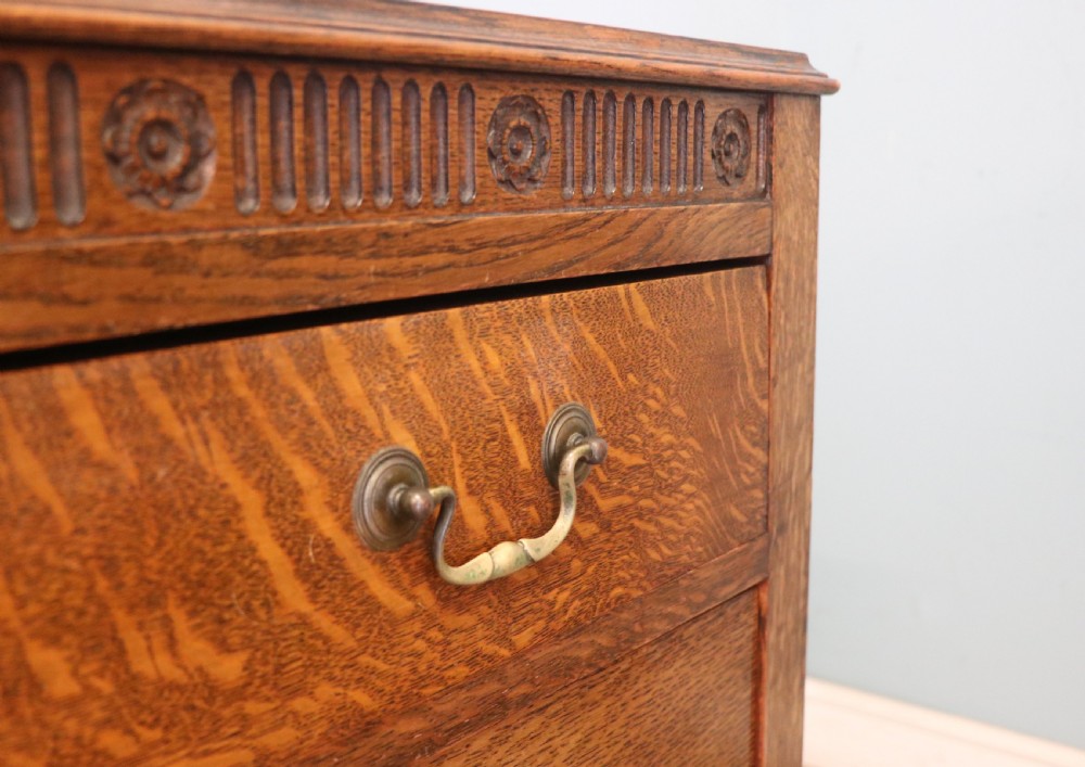 A Edwardian oak combination chest and cupboard. View XVIII