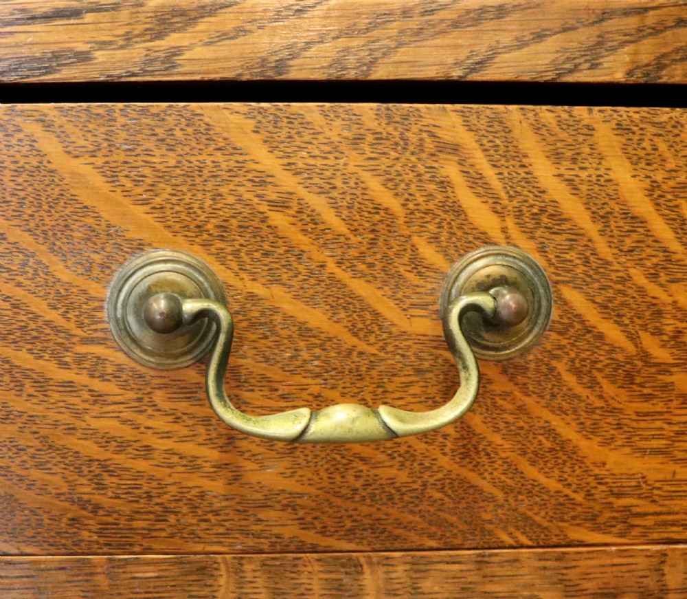 A Edwardian oak combination chest and cupboard. View XIX