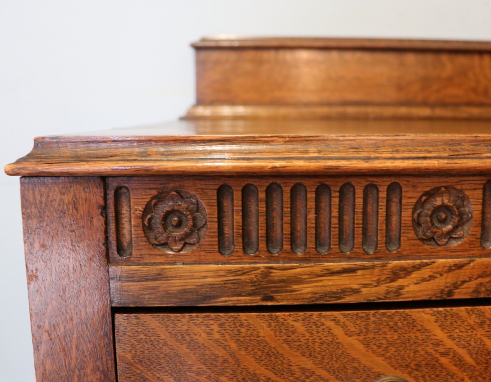 A Edwardian oak combination chest and cupboard. View XX