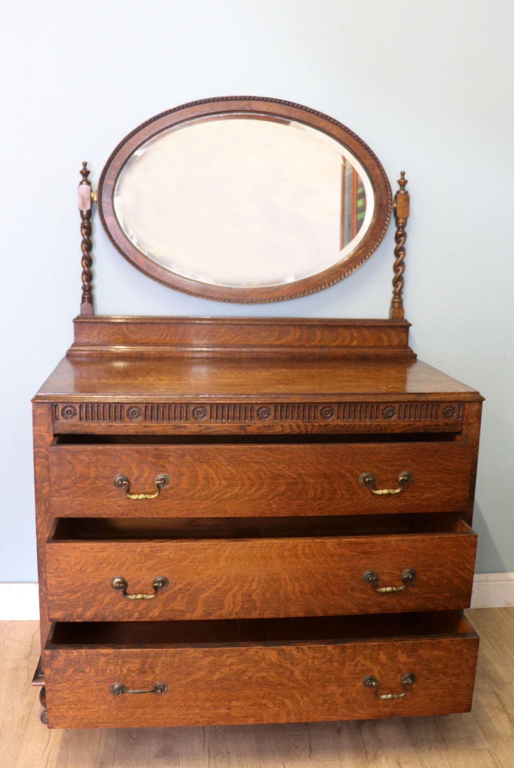 A  Edwardian oak dressing table with an adjustable oval mirror.  View II