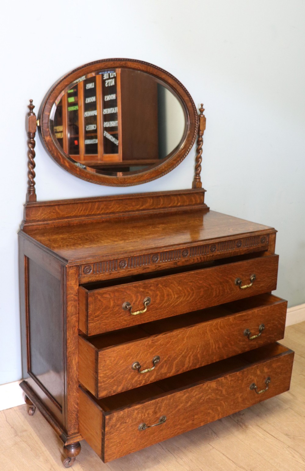 A  Edwardian oak dressing table with an adjustable oval mirror.  View V