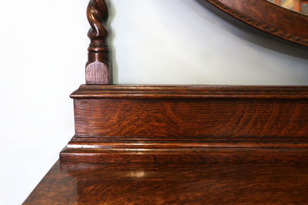 A  Edwardian oak dressing table with an adjustable oval mirror.  View XI