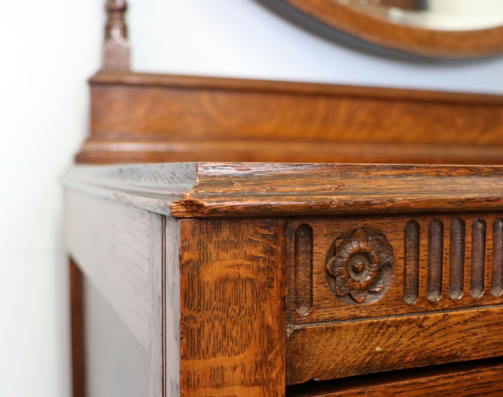 A  Edwardian oak dressing table with an adjustable oval mirror.  View XII