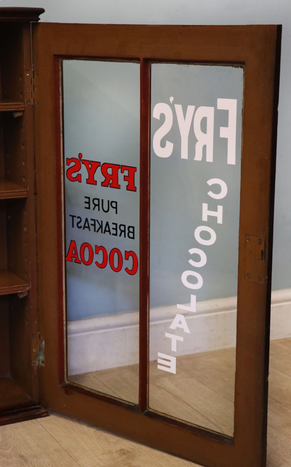 A 19th century mahogany shop display cabinet later sign written for Fry’s cocoa. View XVII