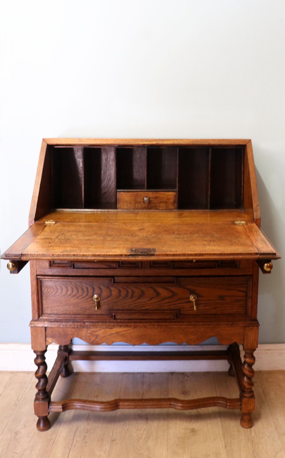 An absolutely charming Jacobean revival oak bureau.