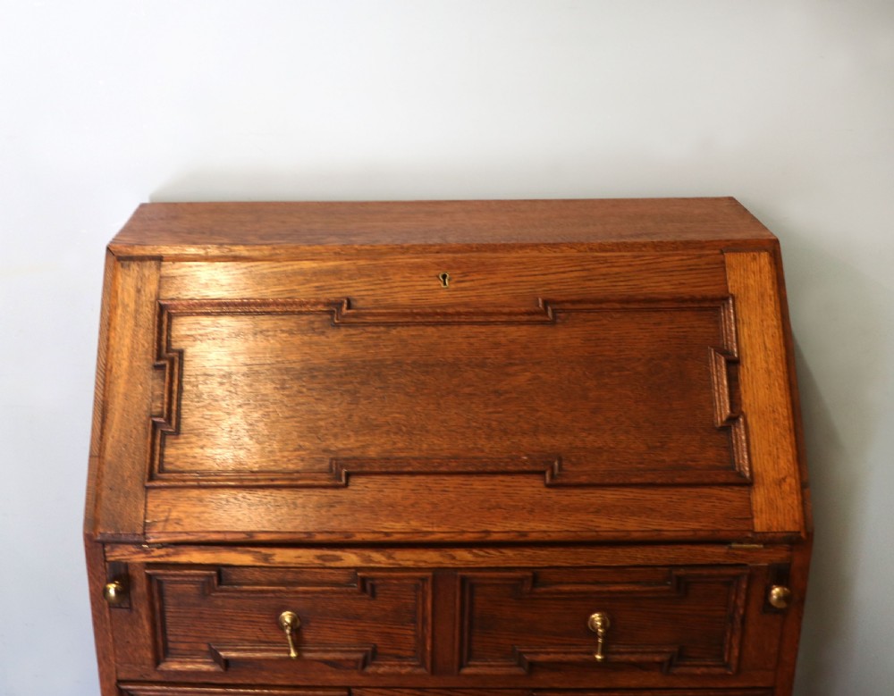 An absolutely charming Jacobean revival oak bureau. View IX