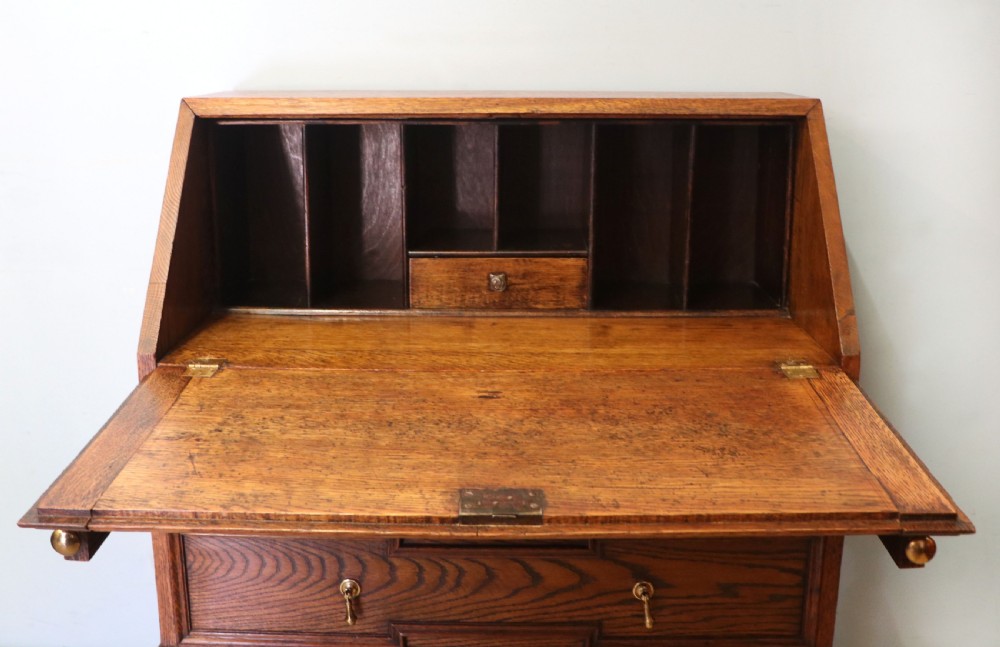 An absolutely charming Jacobean revival oak bureau. View X