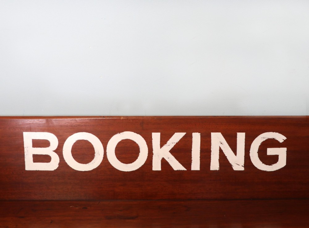 A lovely Victorian mahogany table later sign written booking office. View VI