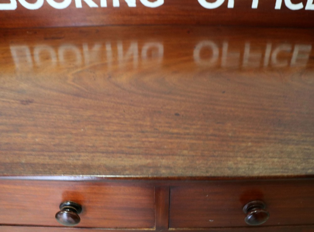 A lovely Victorian mahogany table later sign written booking office. View IX