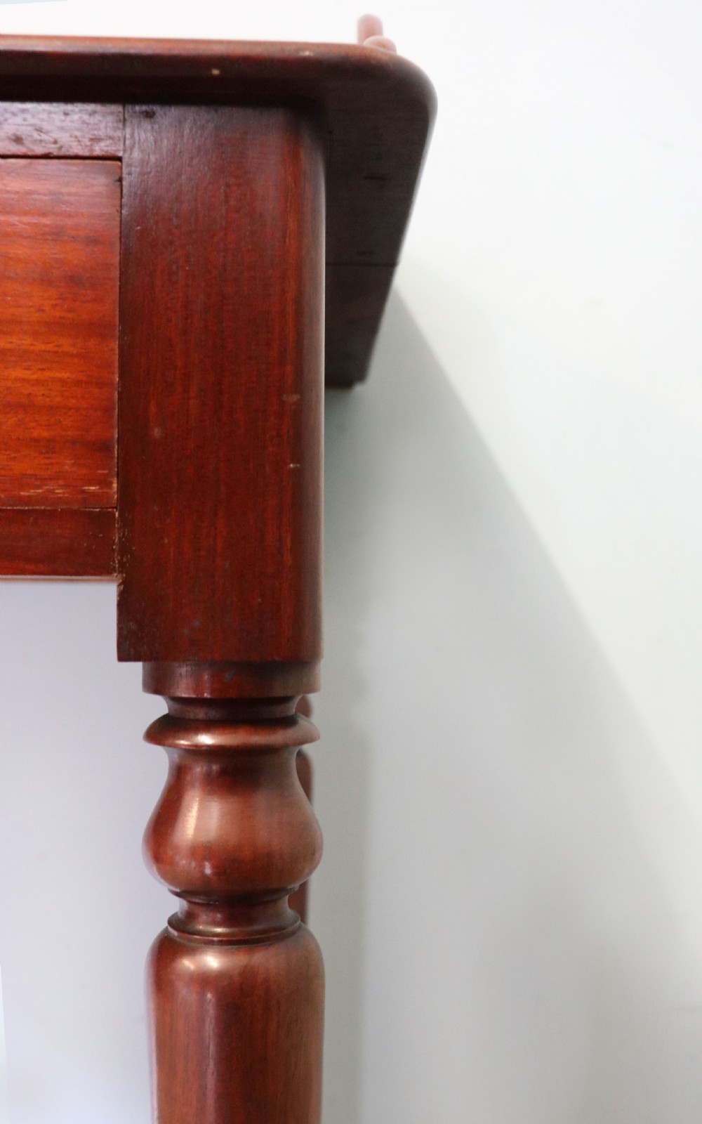 A lovely Victorian mahogany table later sign written booking office. View XIV
