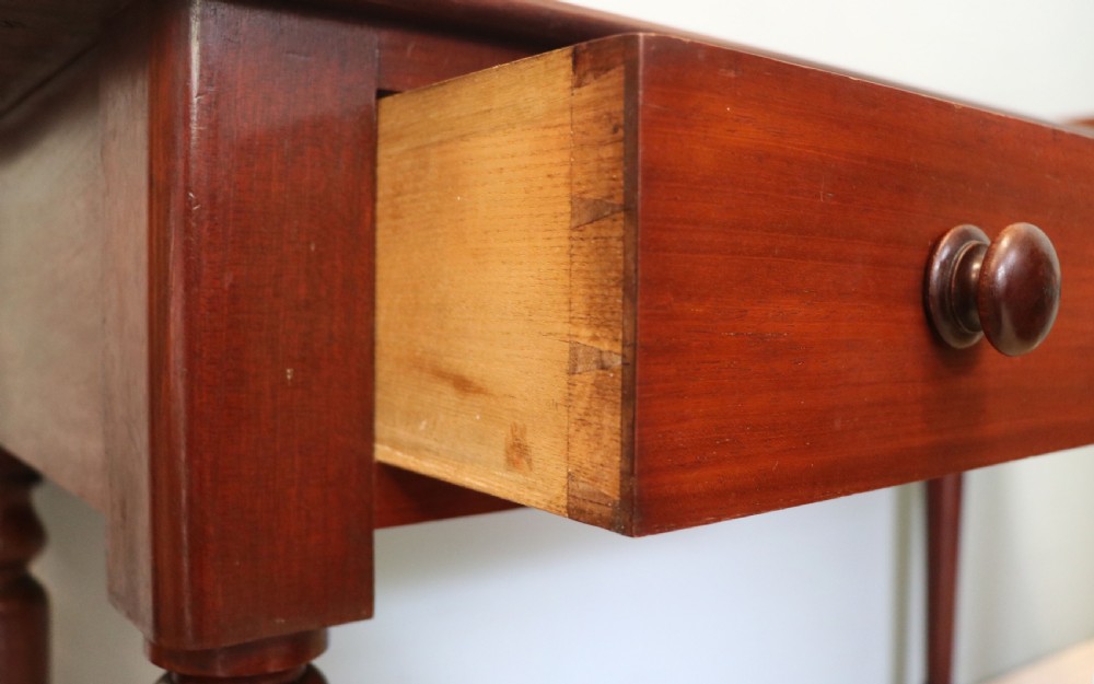 A lovely Victorian mahogany table later sign written booking office. View XVI